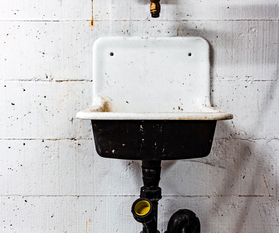 old rusty sink drain